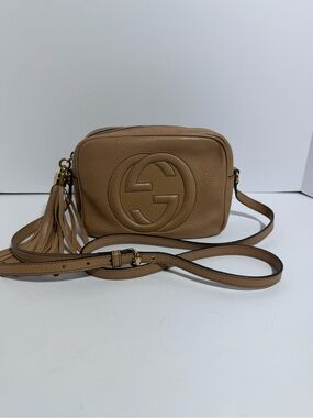 SOLD
Gucci Tan Pebbled Leather Disco Camera Crossbody with Tassel